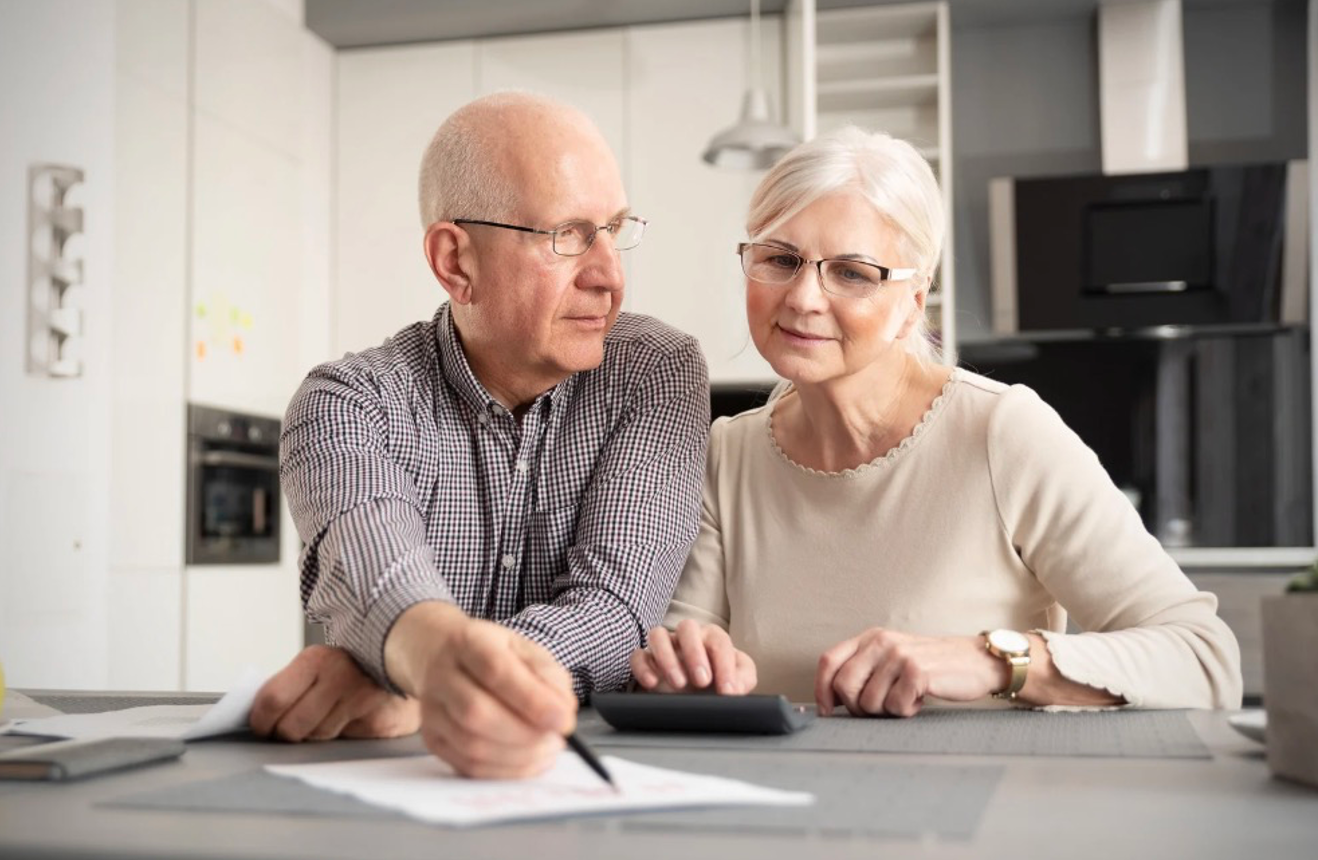 Senior couple discussing retirement investment