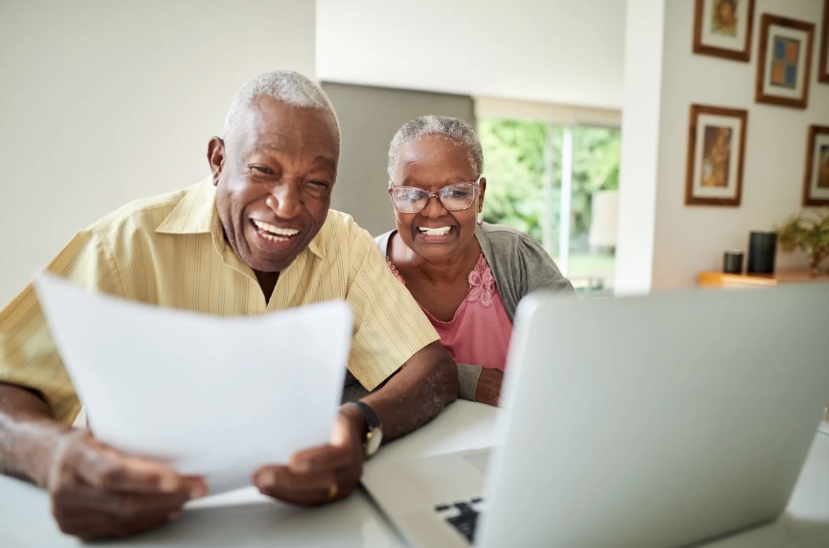 Screenshot two seniors planning their retirement in a senior living community